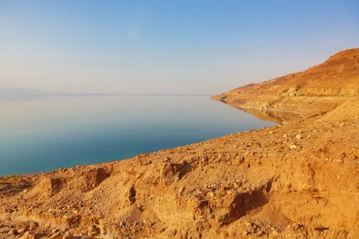  : Barren shoreline and salt water of the Dead Sea, Jordan