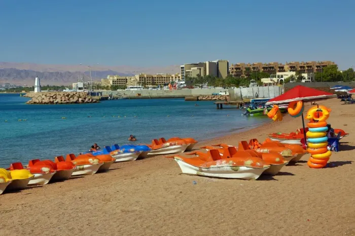  : The beach at Aqaba in Jordan looking towards Eilat in Israel