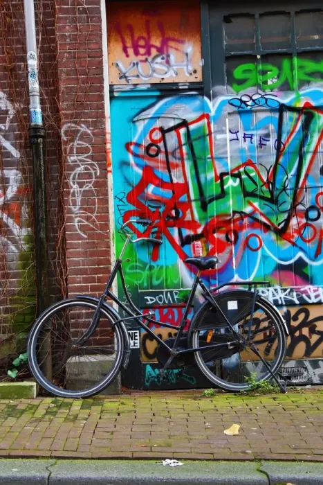  : Bicycle and colourful graffiti street scene in Amsterdam, Holland