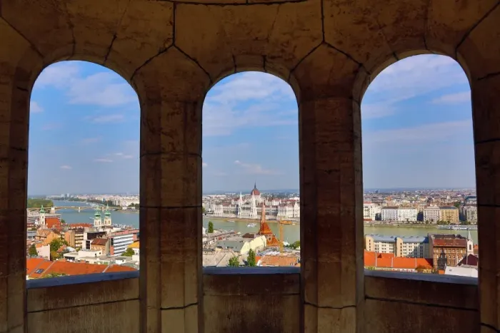  : City skyline seen through a window of the Fishermans Bastion in Budapest, Hungary