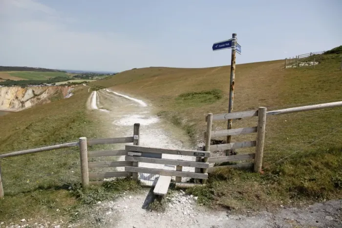 : Stile. Coastal path and wooden stile on the Isle of Wight, England