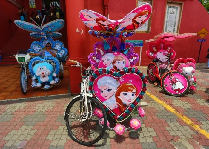  : Decorated kitsch cycle trishaw rickshaw with soft toys in Malacca, Malaysia