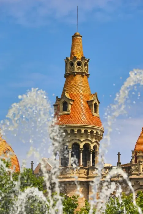  : Fountain in the Placa de Catalunya and turret roofs of buildings in the Passeig de Gracia in Barcelona, Spain