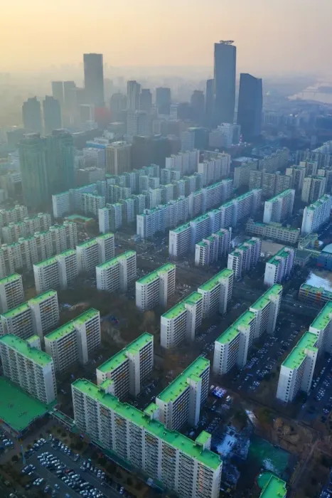  : General view of blocks of flats and the Seoul city skyline at dusk in Seoul, Korea