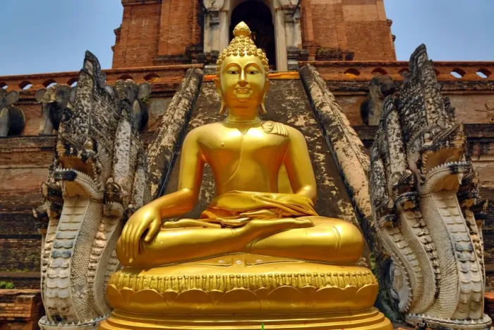  : Gold Buddha statue and the Chedi at the Wat Chedi Luang Temple in Chiang Mai, Thailand