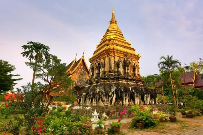  : Gold chedi decorated with elephants in Wat Chiang Man Temple in Chiang Mai, Thailand
