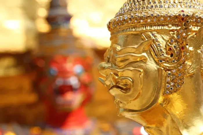  : Golden Kinnara staue and Yaksha Demon at the Wat Phra Kaew Royal Palace complex in Bangkok