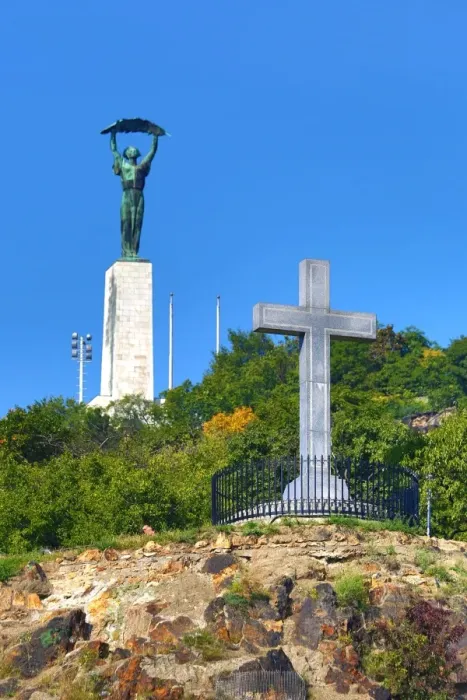  : The Liberty Statue and Cross Monument on Gellert Hill in Budapest, Hungary