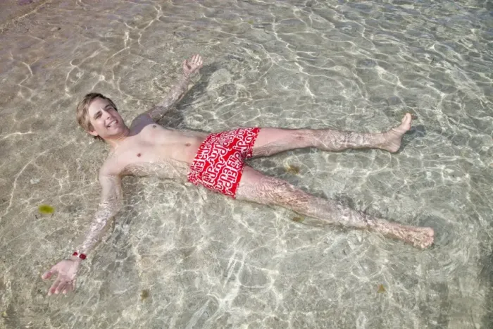  : Man lying in the sea on holiday