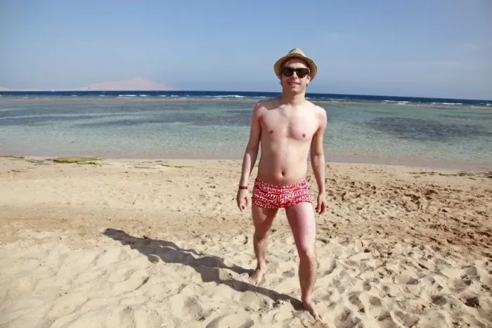  : Man walking along the beach