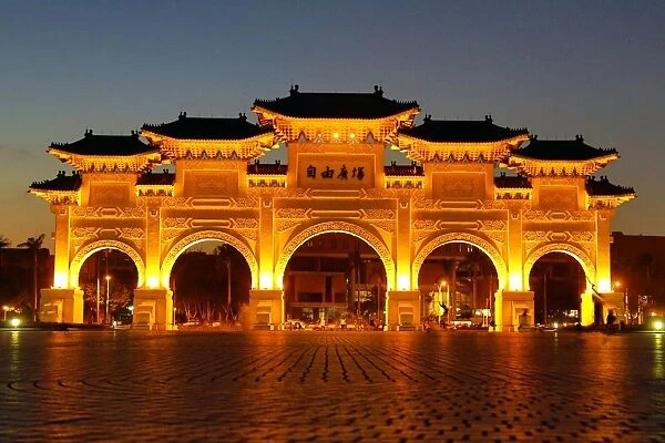 The National Chiang Kai Shek Memorial Hall Main Gate illuminated at night in Taipei, Taiwan
