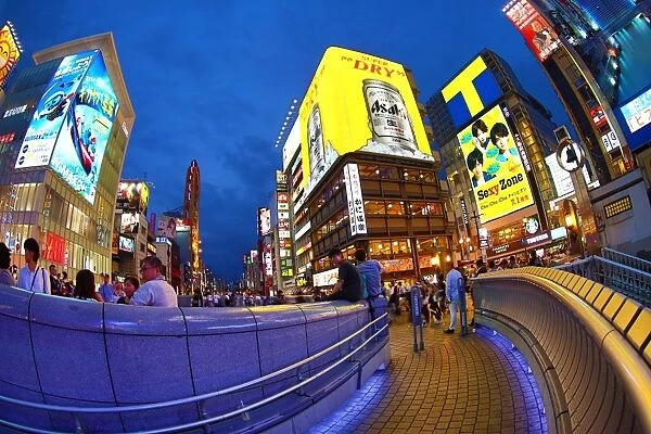 Night scene of illuminations and neon lights on buildings and shops and Kani Doraku