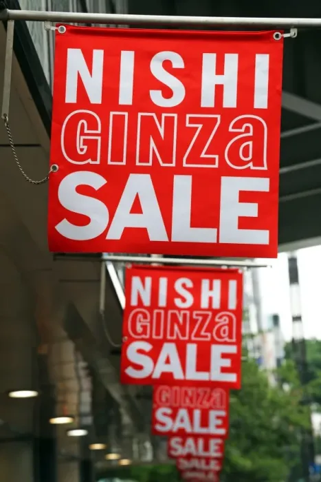  : Nishi Ginza Sale signs advertising shop sales in Ginza, Tokyo, Japan