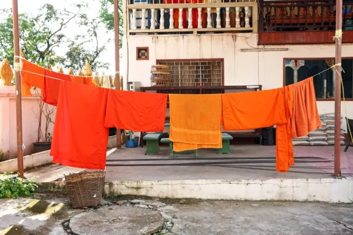  : Orange Buddhist Monk clothes and robes on a washing line, Vientiane, Laos