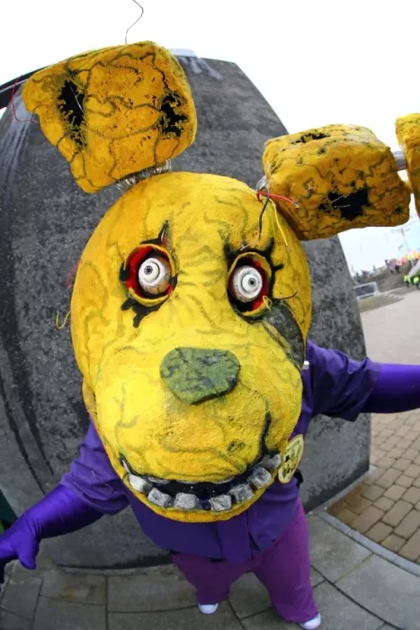  : A participant dressed as the Purple Guy with the Spring Trap at MCM London Comic