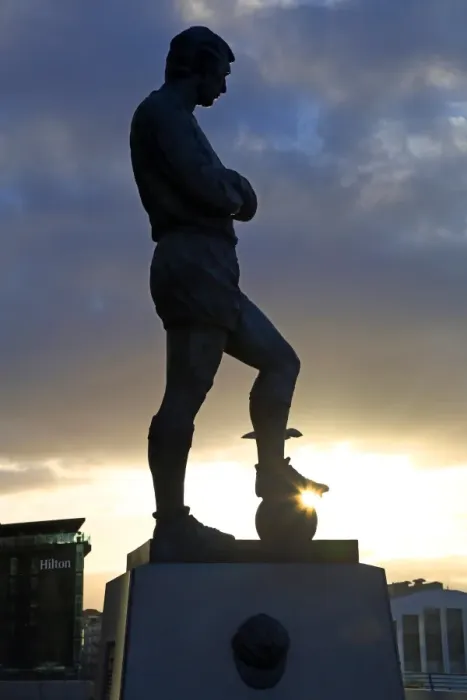  : Silhouette of the statue of Bobby Moore at Wembley Stadium, London, England
