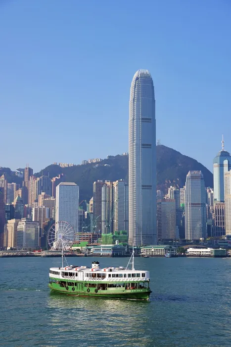  : Star Ferry crossing Victoria Harbour with the city skyline in Hong Kong, China