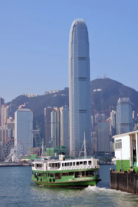  : Star Ferry leaving Tsim Tsa Shui terminal and crossing Victoria Harbour with the city skyline in Hong Kong, China