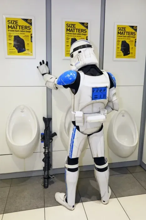  : A Star Wars Stormtrooper takes a loo break in the toilet at MCM London Comic Con