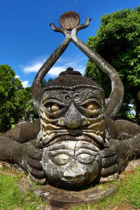  : Statues of Buddha heads and faces at the Buddha Park, Vientiane, Laos