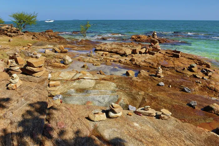  : Stone cairns built on rocks at Tubtim beach on Koh Samet island, Thailand