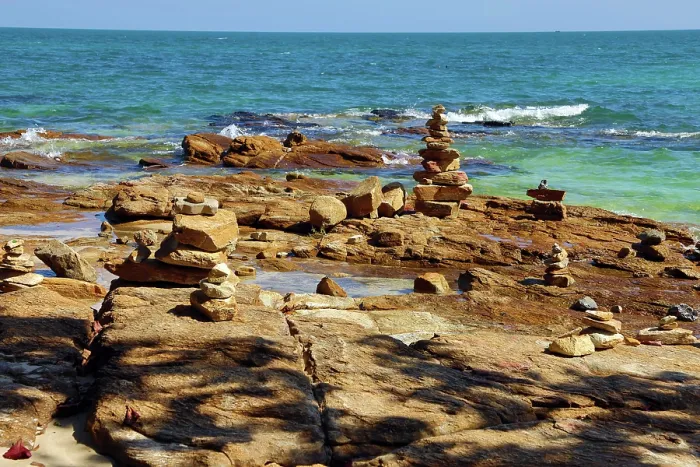  : Stone cairns built on rocks at Tubtim beach on Koh Samet island, Thailand