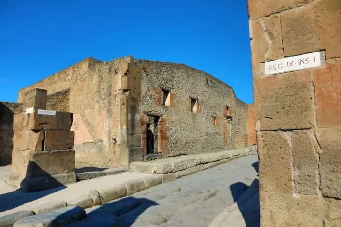  : Street and ruins of houses in the ancient Roman city of Pompeii, Italy