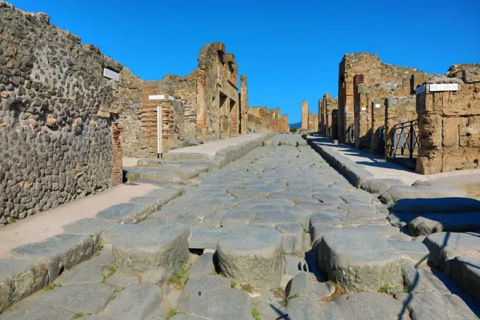  : Street and ruins of houses in the ancient Roman city of Pompeii, Italy