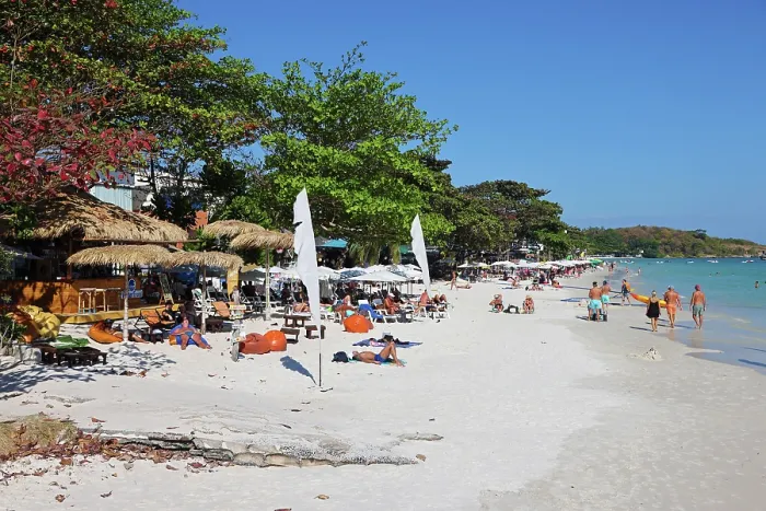  : Tourists sunbathing on Sai Kaew beach on Koh Samet island in Thailand