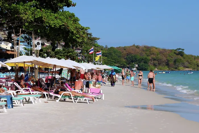  : Tourists sunbathing on Sai Kaew beach on Koh Samet island in Thailand