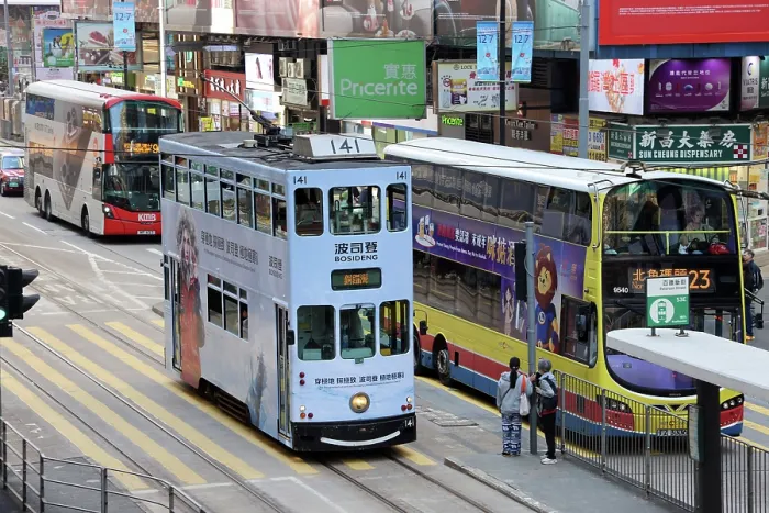  : Traditional Hong Kong electric tram with buses in Causeway Bay, Hong Kong, China