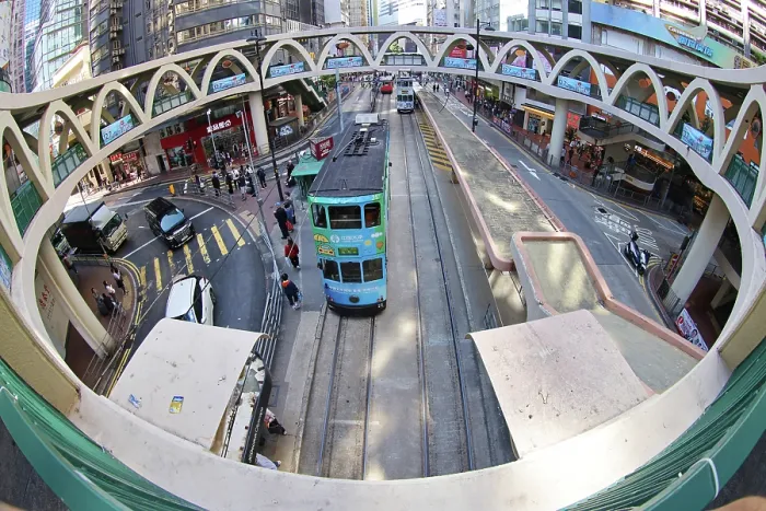  : Traditional Hong Kong electric tram at Yee Wo Street circular pedestrian bridge in Causeway Bay, Hong Kong, China