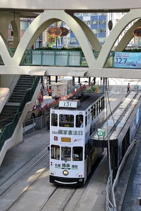  : Traditional Hong Kong electric tram at Yee Wo Street circular pedestrian bridge in Causeway Bay, Hong Kong, China