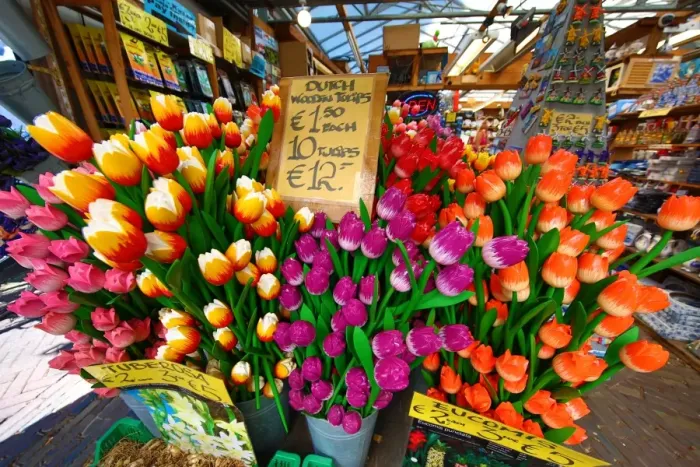  : Wooden Tulip flowers on sale in the flower market in Amsterdam, Holland