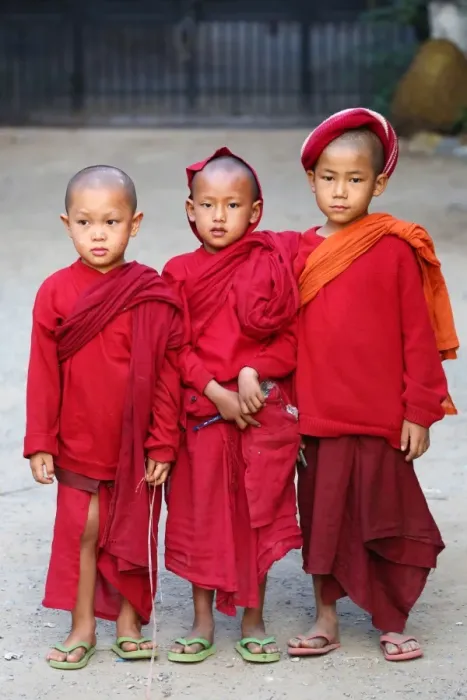  : Three young Buddhist monks at a temple in Amarapura, Mandalay, Myanmar (Burma)