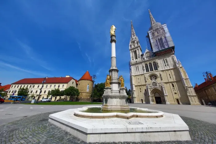  : Zagreb Cathedral with tower renovation and Holy Mary Monument column in Zagreb, Croatia
