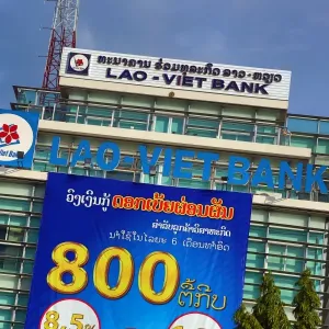 Advertisement on the Lao-Viet bank in Vientiane, Laos Advertisement on the Lao-Viet bank in Vientiane, Laos