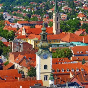 Aerial view of rooftops and the towers of St Marys Church and St Francis Church in Zagreb