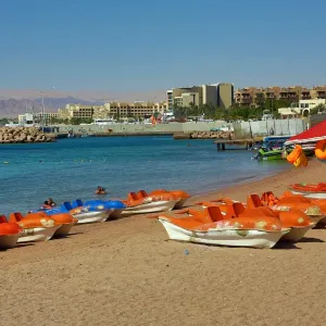 The beach at Aqaba in Jordan looking towards Eilat in Israel