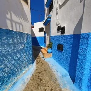 Blue and white walls of buildings in the Kasbah of the Udayas in Rabat, Morocco