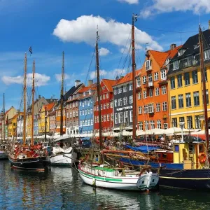 Boats and coloured houses at Nyhavn Quay in Copenhagen, Denmark