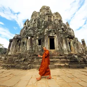 Buddhist monk in the ruins of the Bayon Khmer Temple, Angkor Thom, Siem Reap, Cambodia
