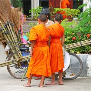 Buddhist Monks buying brushes, Vientiane, Laos Buddhist Monks buying brushes, Vientiane, Laos