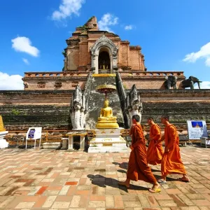 Buddhist Monks at Chedi at Wat Chedi Luang Temple in Chiang Mai, Thailand