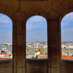 City skyline seen through a window of the Fishermans Bastion in Budapest, Hungary