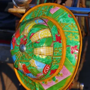 Colourful hat hanging on a bicycle, Yangon, Myanmar