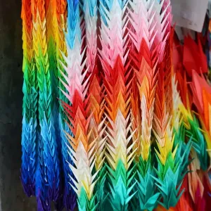 Colourful paper cranes in the Hiroshima Peace Memorial Park, Hiroshima, Japan commemorating the bombing of Hiroshima at the end of World War II. It is a UNESCO World Heritage Site. The 70th anniversary of the 1945 bombing will take place on the 6th August