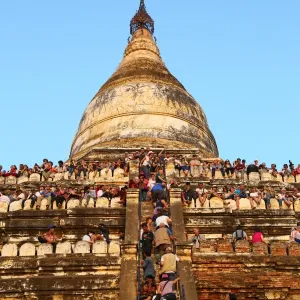Crowds of tourists on Shwesandaw Pagoda to watch the sunset in Bagan, Myanmar (Burma)