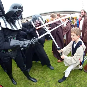 Darth Vader from Star Wars takes on a young Jedi Knight in a light sabre battle