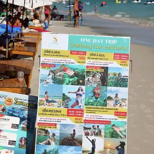 Day trip advertisement board for tourists on Sai Kaew beach on Koh Samet island, Thailand